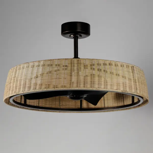 Hand-woven rattan wicker in a natural or darkened finish are shaped into a sloping drum shade with an internal fan and LED light source within them. The contrasting Dark Bronze finish of the metalwork encases an LED ring toward the bottom edge of the shade allowing for a strobe-free light effect directed downward. The surface coatings are rated for outdoor applications so the rattan and the metalwork are purposefully designed for outdoor spaces under covered roofs. Transform your patio with coastal flair and escape the heat with this Fandelight by Maxim. - alternate view