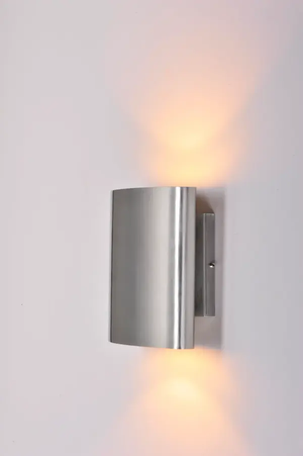 Indirect exterior lighting not only provides illumination where you want but it also highlights the building structure for a beautiful architectural effect. Our collection of up and down lighting fixtures are available in both Architectural Bronze, Black, and Brushed Aluminum. Collection: Lightray LED Finish: Brushed Aluminum Width: 6.75" Height: 7.00" Weight: 3.12 lb Extension from Wall: 3.50" Canopy: 4.75"x4.75" Bulbs Included Number of Bulbs: 2 Maximum Wattage: 6.00 W Bulb Type: PCB Bulb Base: PCB Integrated Light Source: LED Light Output: 840.00 lm Color Temperature: 2700 K CRI: 90 Voltage: 120.00 V Material: Aluminum, Glass Safety Listing: cETLus Safety Rating: Wet ADA LED Spec Sheet Instructions Parts Diagram - alternate view