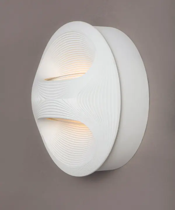 Suitable for both Indoor and Outdoor applications, the Influx series features a step detail that pulses out from the center of the Die Cast Aluminum structure. Bright rays of LED light create a shadow effect that is projected onto either the wall or ceiling, accentuating the lamp's unique form. - alternate view