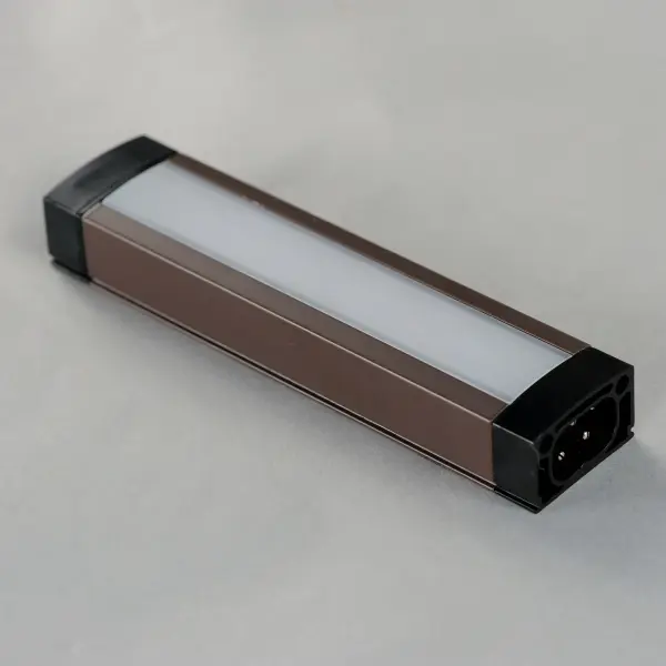 An innovative, slim channel LED light bar. The 120V input Slim Stick connects to a slim direct wire installation junction box where brightness and white color tunable LED light can be adjusted with the touch of a button. The control is the first in the industry to provide color temperature control variable between 2700-5000k on a driverless 120V LED strip. Included with the product, mounting clips allow the user install the channels flat or at an angle up to 90 degrees, so the product can be used in more applications such as cove, task, and closet lighting. - alternate view