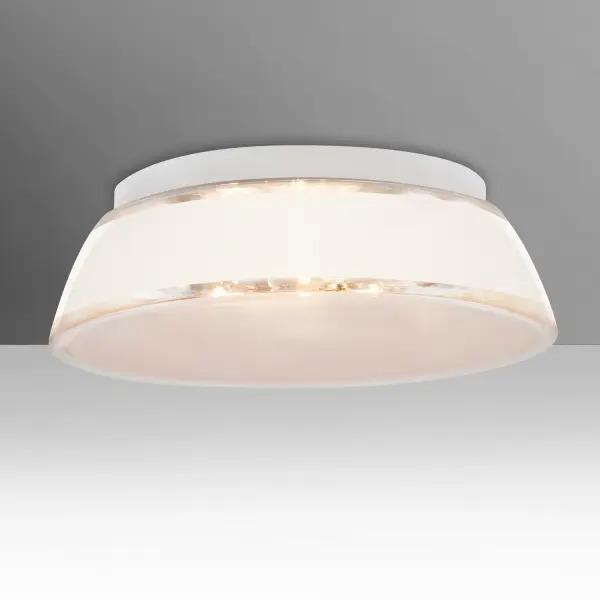 The Pica White Sand flush mount showcases artisanal craftsmanship with real fine-grained sand applied to blown glass. The frosted bottom and clear outer finish create beautiful light refraction, making it a functional work of art.