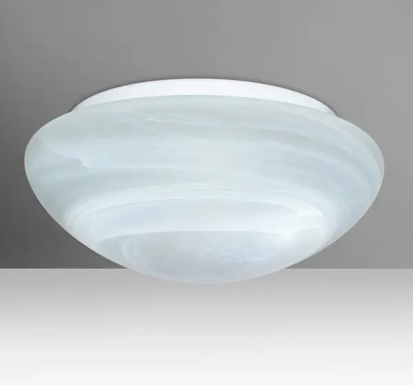 The Bobbi Marble flush mount features handcrafted pressed glass with swirling white threads that mimic natural marble. Its semi-translucent frost finish provides functional yet calming light, perfect for intimate spaces.