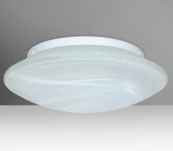 The Sola Marble flush mount combines handcrafted pressed glass with a contemporary low-profile design. White swirls throughout semi-translucent frost create a sophisticated faux alabaster appearance that delivers functional, soothing illumination.
