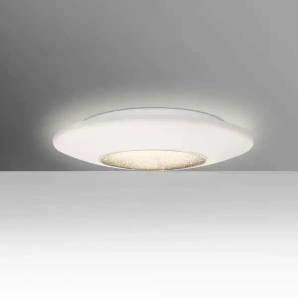 The Viva ceiling fixture collection is comprised of an Opal perimeter accented with a sparkling prismatic disc fused to the clear bottom center. The result is an appealling contrast created from the soothing illuminated opal against the brilliant effect created by the play of the LED light through the bottom prisms.