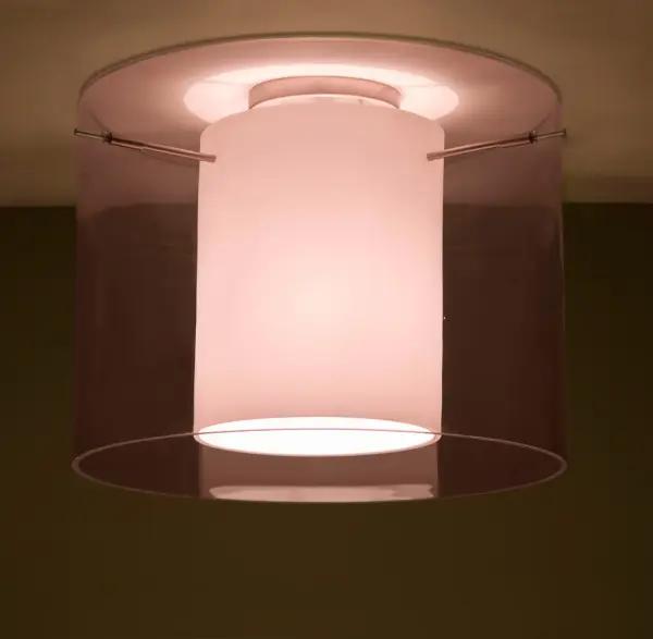 The Pahu 16 combines century-old glassblowing techniques with contemporary design. Its distinctive double-glass construction features a sparkling Trans-Amethyst outer layer and soft Opal inner cylinder, creating a tranquil glow perfect for intimate spaces.