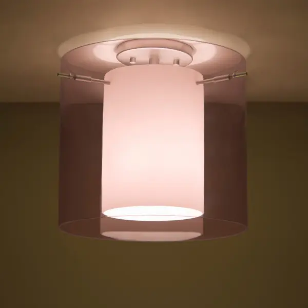 The Pahu combines century-old glassblowing techniques with contemporary design. Its distinctive double-glass construction features a hand-etched opal inner cylinder surrounded by sparkling trans-amethyst outer glass, creating a sophisticated glow perfect for intimate spaces.