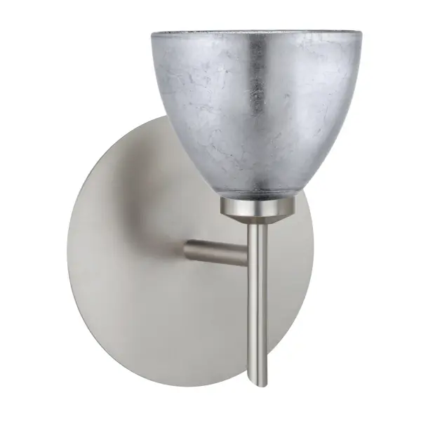 The Divi Silver Foil sconce combines classical bell-shaped design with handcrafted artisan glass featuring distressed metal foil. Each piece is unique, creating textured depth and sparkling light effects when illuminated.