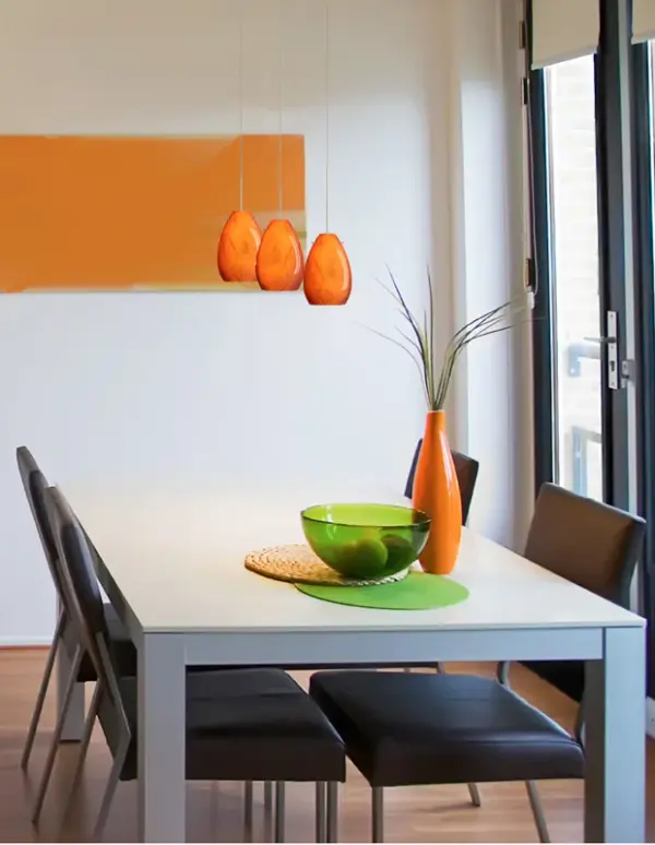 The Pera 6 Habanero features stunning handblown art glass with warm persimmon coloring and marbleized black accents. Each piece is unique, crafted using century-old techniques. The curvy bell-bottomed shape adds contemporary elegance to any space. - alternate view