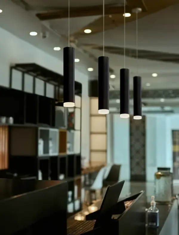 The Cafe 12 combines streamlined contemporary design with practical downward illumination. Its black glass shade with frosted bottom creates a sophisticated glow while the compact 12-inch size makes it perfect for task lighting or grouped installations. - alternate view