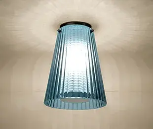 The Dion semi-flush mount blends classical Corinthian fluted column aesthetics with contemporary perforated diffuser technology, creating a sophisticated lighting solution that bridges traditional and modern design sensibilities.