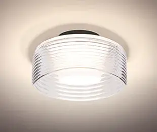 The Belu semi-flush mount combines horizontal ribbed glass detailing with a white acrylic diffuser for soft, elegant illumination. Its compact 7.875" diameter makes it ideal for smaller spaces requiring refined lighting.