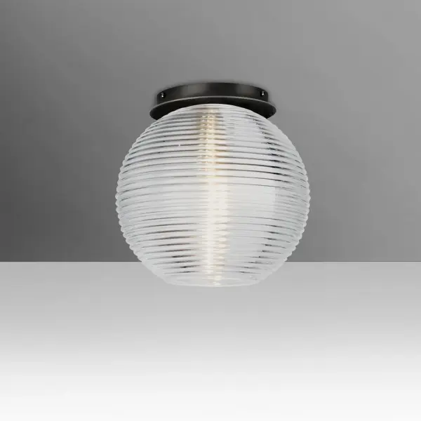 The Kristall pendant features distinctive ridged clear blown glass that sparkles beautifully when lit. Handcrafted using century-old techniques, this versatile globe design complements both classic and modern interiors with effortless elegance.