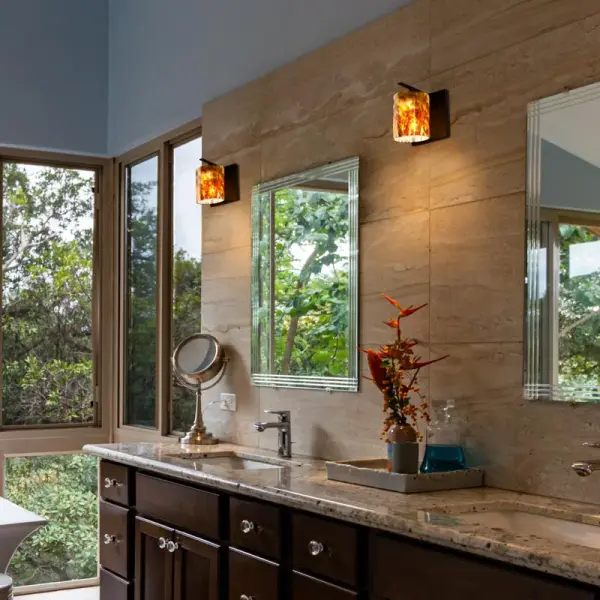 The Lava vanity sconce features one-of-a-kind art glass with swirling reds, browns, and orange tones accented by effervescent bubbling. Perfect for adding dramatic visual interest to bathrooms and powder rooms. - alternate view