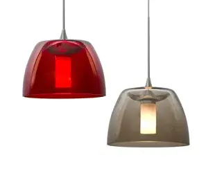 The Spur mini pendant features a distinctive double-glass design with a frosted inner cylinder suspended within a clear outer glass shade. Its compact 5.5" diameter makes it perfect for task lighting or clustered installations.