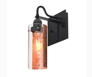 The Duke Sconce combines transitional design with modern sophistication through its foil-backed textured glass cylinder and clear glass accents. The metallic effect creates visual interest while maintaining versatility.