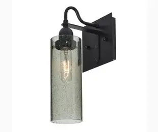 The Juni 10 Sconce features a distinctive transparent glass cylinder with randomly blown bubble patterns, creating visual interest and soft light diffusion. Its compact 10-inch height makes it ideal for bathrooms and hallways.