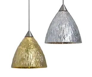 The Eve mini pendant features a classic bell-shaped shade crafted from handcrafted glass. Its compact 5-inch diameter makes it perfect for task lighting or clustered installations in kitchens and bathrooms.