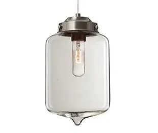 The Olin pendant combines mid-century modern aesthetics with contemporary minimalism. Its closed-bottom cylindrical glass shade with pointed accent creates visual interest while maintaining clean lines.