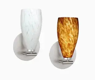 The Karli wall sconce offers a graceful, understated design that complements virtually any décor. Its compact 5-inch profile and softly curved glass shade make it ideal for smaller spaces requiring ambient lighting.