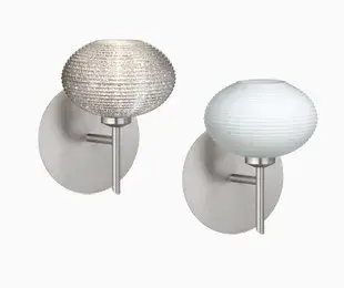 The Lasso wall sconce features distinctive handcrafted glass with softly radiused ridges that bring textural interest to contemporary spaces. Its compact 5-inch profile makes it ideal for bathrooms and hallways.