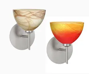 The Brella wall sconce features a timeless bell-shaped glass shade that delivers optimal illumination while complementing various design aesthetics. Compact at 6 inches wide, it's ideal for bathrooms and hallways.