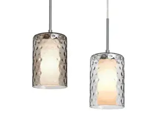 The Esa Pendant features a distinctive dimple-patterned glass cylinder that creates beautiful light diffusion. Its compact 4.7-inch diameter makes it ideal for smaller spaces or multi-light installations.