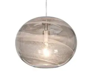 The Geno Pendant features a distinctive 13-inch elliptical glass shade with vapor-like patterning that creates visual intrigue while softly diffusing light. Its contemporary design and versatile mounting options make it adaptable to various spaces.