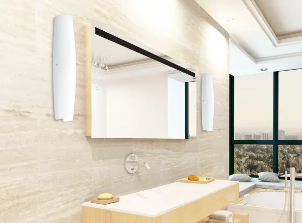 The graceful Mistral wall sconce has minimal hardware to show off the beautiful open-ended handcrafted glass. It’s elongated vertical shape has greater scale for larger spaces. ADA-Compliant. Our Opal glass is a soft white cased glass that can suit any classic or modern decor. Opal has a very tranquil glow that is pleasing in appearance. The smooth satin finish on the clear outer layer is a result of an extensive etching process. This blown glass is handcrafted by a skilled artisan, utilizing century-old techniques passed down from generation to generation. - alternate view