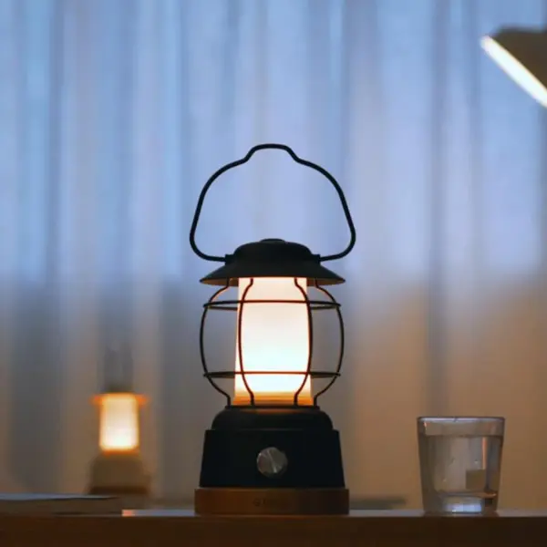 The Kibün S'mores combines vintage camping lantern charm with modern LED technology. Delivering 550 lumens with full dimming control and dual lighting modes, this IPx4-rated portable light offers 6+ hours of runtime and doubles as a USB power bank for devices. - alternate view