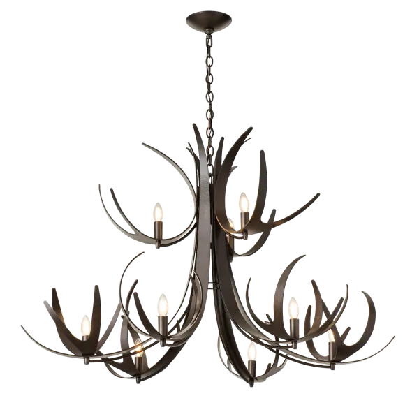 This two-tier, nine-light Caribou chandelier is unique from every angle. Its scale is impressive...at more than 4ft in diameter at the bottom. Our designers' interpretation of nature's antlers, our Caribou boasts 39 points in this stylized, hand-forged display of artisanal talent. Each piece is heated in the fires of the forge, giving it a distinctive "fingerprint" all its own. Make a statement with this grand focal piece. Available in any of our standard interior finishes, or choose an RAL option for a pop of color for a modern twist! - alternate view
