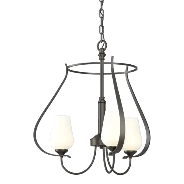 This three-armed chandelier showcases our Vermont forge work. From the circlet crowning the piece, to the bands swooping down, to the round bars that sprout the glass, the hand-shaped steel delivers curve after curve.