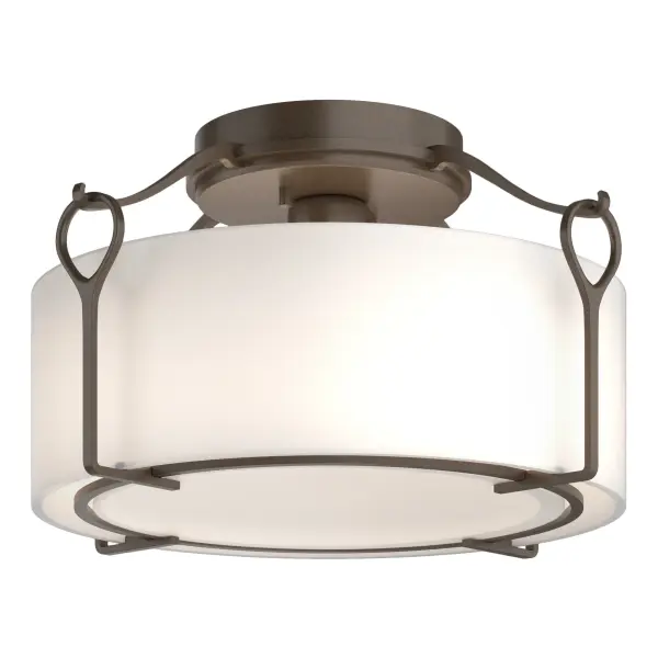 The versatile Bow Medium Semi-Flush features simple lines, suited to multiple settings and design styles. Classic hook and loop details suspend a glass shade, available in 2 glass options, while a lightly curved bottom glass diffuser disperses the light. Also available in standard and Large versions.