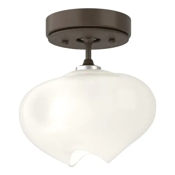 The Ume Semi-Flush features a single, exquisite glass shade that has the distinction of being glossy on the outside, yet frosted on the inside, creating a unique appearance, combined with its botanical shape. The Ume frosted glass, like its namesake Japanese plum blossom, has an elegant and sophisticated aesthetic and extends from the straight arm of this semi-flush mount. Available in all standard finishes.