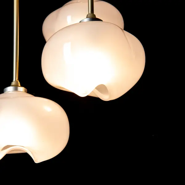 The Ume 3-Light Semi-Flush offers the opportunity for a staggered length ceiling fixture to illuminate your space. With three unique Ume frosted glass shades, it has a botanical feel. A soft, yet functional, light is emitted from within these exquisite shades that are frosted on the inside, glossy on the outside. Available in all standard finishes.
