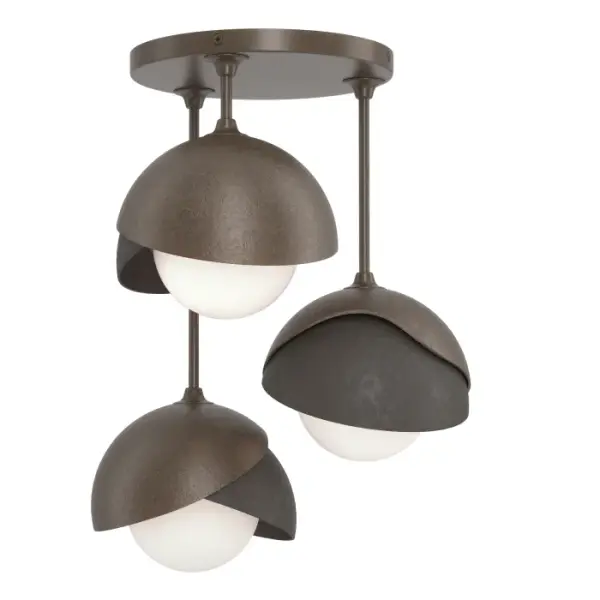 This Brooklyn Double Shade Semi-Flush has three lights extending from staggered straight arms. With the forged and textured, handcrafted two-shaded Brooklyn, the option of a two-toned ceiling fixture is offered with the ability to have one shade in an accent color. Available in all standard finishes.