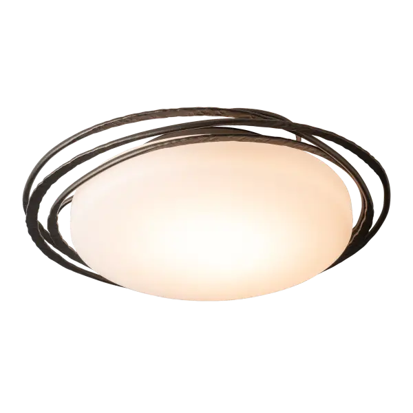 Offering the versatility of light, with 3 selectable color temperatures (2700/3000/4000K), this smaller Nova semi-flushmount fixture will fit a variety of spaces with its 17.6" diameter. The Nova's beautiful rings encircle the round lighting element contained within an opal glass diffusing the light. Each of the three rings is forged in 2000º fires of the forge and hand-hammered by Vermont artisans. - alternate view