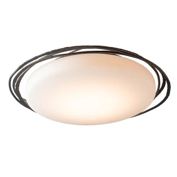 Need scale? At nearly 29" in diameter, this large Nova LED Flush Mount fixture is stylish enough for a grand foyer and functional enough for a mudroom. Simple, classic, but with trademark Hubbardton Forge touches from our artisans. Three large, hand-forged and hammered steel rings encircle the large, round frosted glass that encases the light. The Nova features a selectable CCT offering three options (2700K/3000K/4000K) that can be set during installation for just the right level of lighting in any space. - alternate view