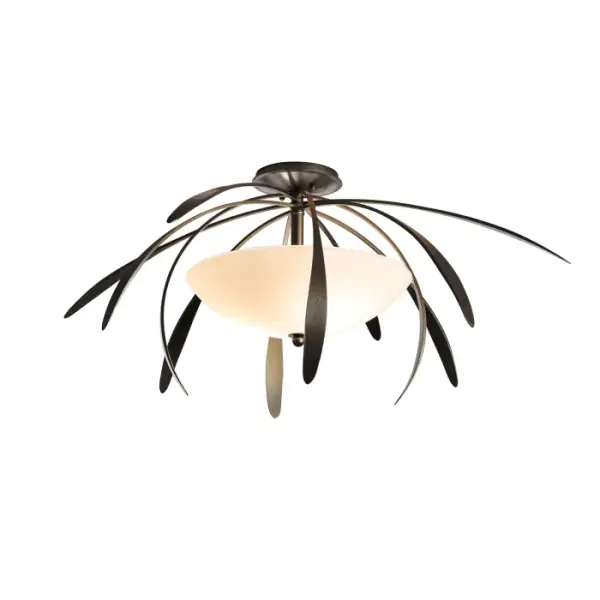 A new entry to the acclaimed Dahlia Collection, this 2021 Dahlia Semi-Flush is over 32" in diameter and almost 14" in height. With its hand-forged, trademark "petals", the glass inverted coppola serves as a diffuser for the light within.