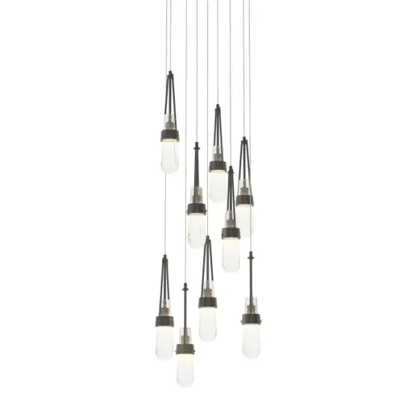 The ever-popular Link Collection expands to include new multi-port fixtures. The Link 9-Light is a multi-port round canopy from which nine pieces of blown glass are in staggered suspension, creating a focal piece for any space. Handmade by local Vermont masters of the art of glassblowing, glass is offered in a choice of clear white threaded or clear bubble. Metalwork is available in all standard finishes.