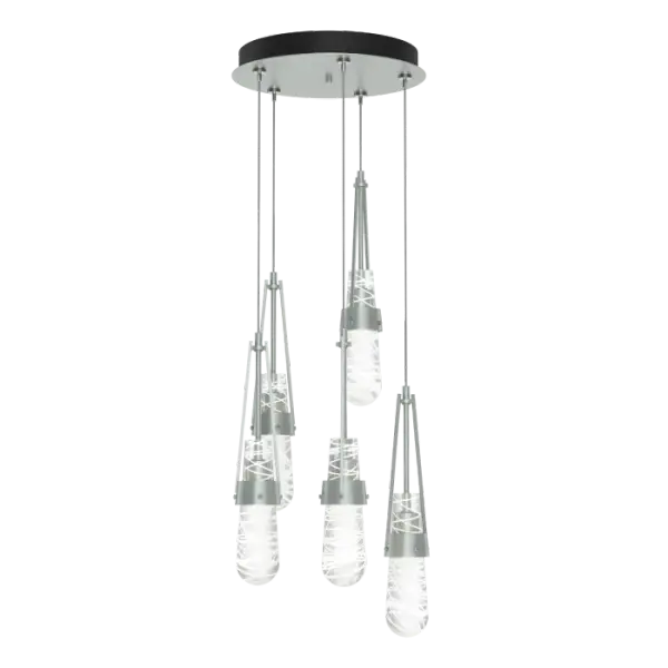 The popular Link Collection continues to grow with the Link 5-Light Blown Glass Pendant. This versatile, five-light multi-port is as easily at home as a focal piece creating cascading light, as it is as a unique and dramatic semi-flush, thanks to the enormous adjustability of the Link’s cable heights. Beautiful, artisanally blown glass (clear bubble or white threaded) from our Vermont neighbor, adorns this hanging fixture.