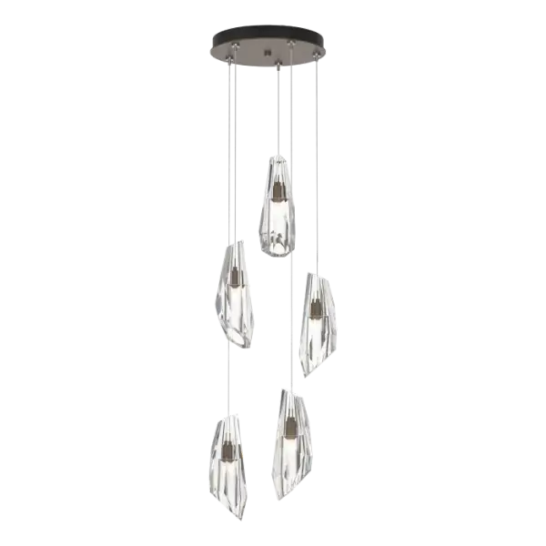 Large hand-cut and polished crystal shades adorn the stunning Luma 5-Light Pendant. A smaller multi-port chandelier with remarkable versatility thanks to the large adjustability of its cable heights, the Luma can serve as either a pendant or a dramatic semi-flush. With 5 Luma crystals, this elegant piece offers the ability to customize the length of each individual pendant to suit the space.