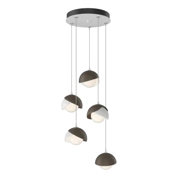 The Brooklyn 5-Light multi-port chandelier is available with a two-tone design, offering the opportunity for contrasting finishes for Brooklyn's double shades. Shades are forged and handcrafted by Vermont makers, with the trademark texturing visible in the metal. Available in all standard finishes, Brooklyn 5-Light pendants can be custom-staggered on its round canopy to perfectly fill the space.
