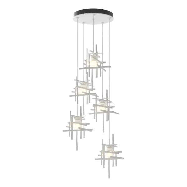 An artfully crafted ceiling fixture that will give your space an instant update, the Tura 5-Light Pendant is perfect for spaces where you want a modern design. Each unique pendant is hand-textured with a trip hammer and custom dies, and made from annealed aluminum with a frosted glass shade. With the ability to customize each pendant’s length, the Tura 5-Light can go from a shortened cable semi-flush to a staggered longer-length for cascading light.