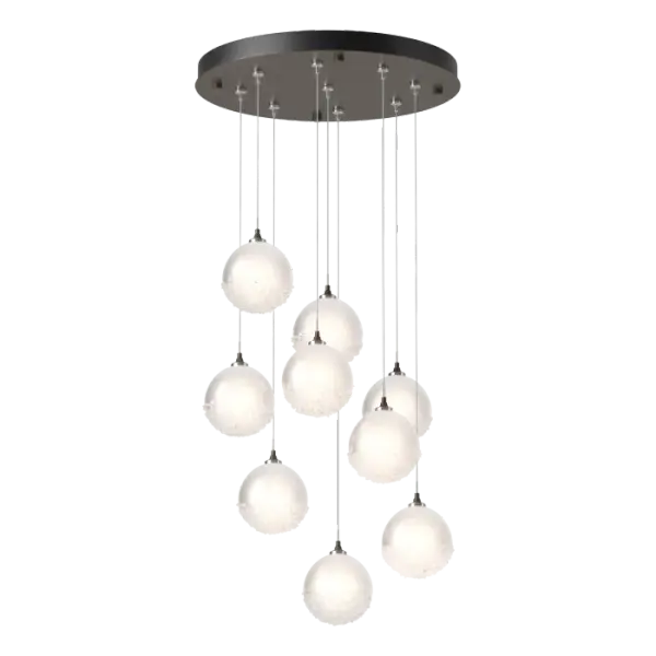 The Fritz Globe 9-Light Pendant is a stunning ceiling fixture that will add a graceful touch to its surroundings. Nine glass spheres are etched on the inside to provide more diffuse light, and the bottom of the outer glossy surface is covered in a heavily-textured fritted glass. This multi-port lighting fixture with its round canopy allows you to customize the lengths and positions of each individual pendant, including a waterfall of cascading light creating an elegant focal point.