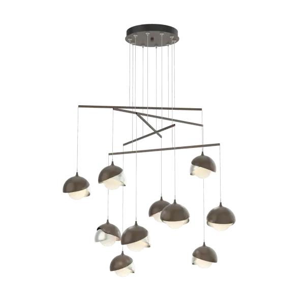 Hand-forged shades shield each light of the Brooklyn Double Shade Mobile. With its mobile platform, the Brooklyn's canopy is minimized and its reach is maximized. Delicate metal tubes guide cables for a highly-adjustable configuration. The shades are available as a two-tone option, with shades that can be in contrasting finishes, if desired. Vermont artisans hand-forge and texture each shade for a distinctive look.