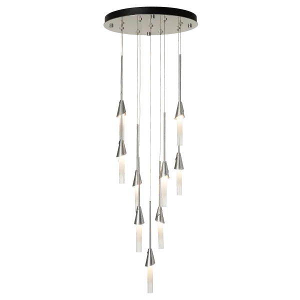 The Lilium 9-Light multi-port pendant makes a statement in any stairwell or other central or corner space. Create a waterfall of light with staggered pendants. Highly-customizable, each individual pendant is suspended via low-voltage cable from its round canopy. Each bobèche “cup” is hand-forged by master artisans in Vermont, creating uniquely textured and shaped elements that are both visual and tactile. The ombre glass adds a touch of sophistication to this simple, yet elegant display. - alternate view