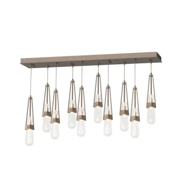 This linear Link multi-port fixture provides great customization options—the two rows of Link blown glass may be staggered or even, at a desired length from its rectangular canopy. Steel cuffs, handmade by Vermont artisans, embrace the glass of this Link 10-Light ceiling fixture. Handmade by local Vermont masters glass artisans, this Link's glass is offered in a choice of clear white threaded or clear bubble. Metalwork is available in all standard finishes.