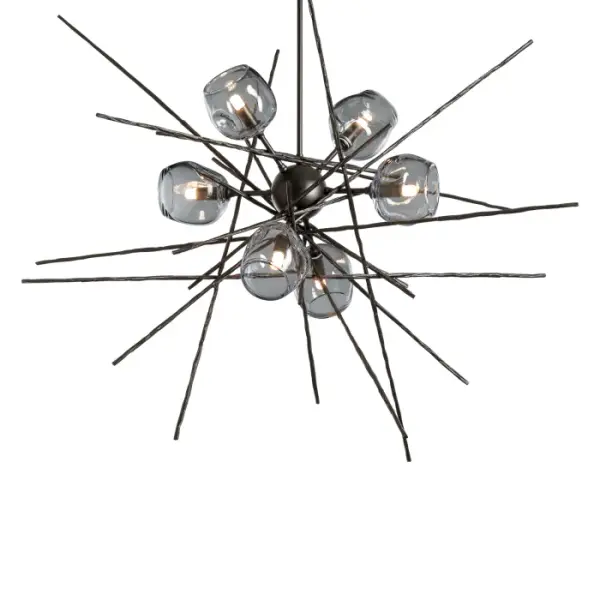 The Griffin Starburst Pendant features six unique, "thumbprint" glass shades. The starburst design is achieved with handcrafted, hammered steel rods created by Vermont artisans to look like the natural tree bark of intersecting twigs.The organic shaped glass is available in clear and cool grey.