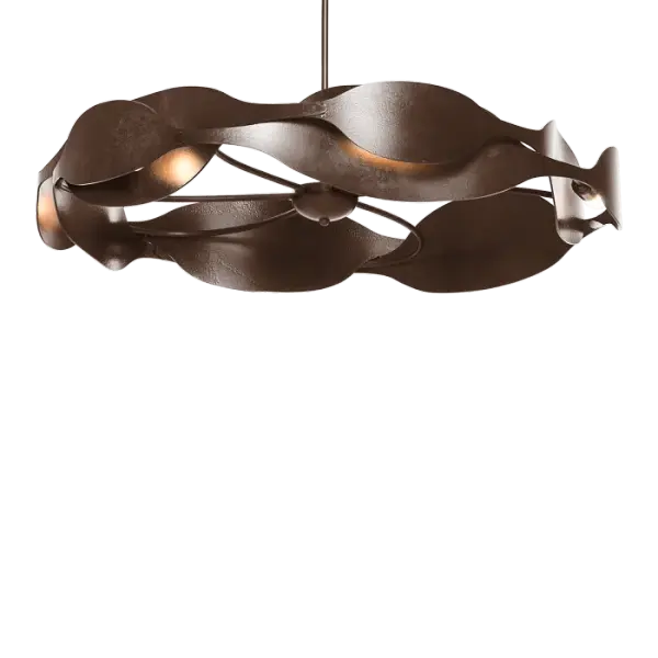 With a sensual interplay of light and shadow, the Waves Pendant suggests a fluidity of motion, an eternal circle of life. Heavily textured steel showcases the skill of the American metalcrafters and artisans at the Forge.