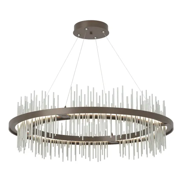 Part of the 2020 Gossamer Collection, the large Gossamer Circular Pendant brings a regal look to any space. Thin vertical spires pierce through an LED lightguide platform embedded in the Gossamer's central frame, creating an ethereal wash of up-and-down light. Offered as a two-toned option with canopy/rods/frame finish + choice of accent color for the Gossamer spires. Also available as a cable-hung and a large rod-hung linear pendant.